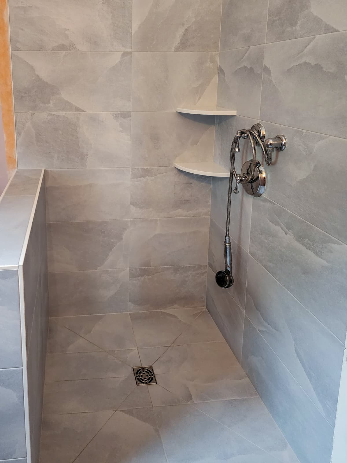 Large gray porcelain shower tile panels with minimal grout lines